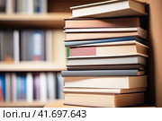 Stack of books on shelf in library, closeup. Education concept. Стоковое AI-изображение, AI-художник Галина Царькова / Фотобанк Лори
