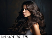 Portrait of a beautiful brunette with long wavy hair on a dark background. Generated by AI. Стоковое AI-изображение, AI-художник Ярославский Максим / Фотобанк Лори