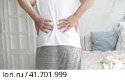 Back pain, kidney inflammation, man suffering from backache at home, health problems concept. Стоковое видео, видеограф Станислав Тарко / Фотобанк Лори