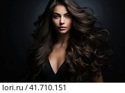 Portrait of a beautiful brunette with long wavy hair on a dark background. Generated by AI. Стоковое AI-изображение, AI-художник Ярославский Максим / Фотобанк Лори