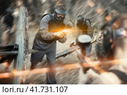 Man aiming with paintball market on battleground. Стоковое фото, фотограф Яков Филимонов / Фотобанк Лори