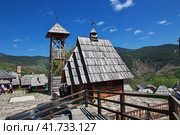 Drvengrad, Serbia - 27 Apr 2018: The church in Drvengrad village, Serbia. Редакционное фото, фотограф Сергей Стрелков / Фотобанк Лори