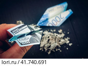 Rubles and dollars on fire in the form of paper airplanes, concessionary and sanctions. Стоковое фото, фотограф Igor Skripachev / Фотобанк Лори