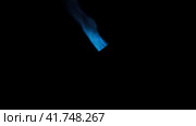 Gas burner flame. Blue fire isolated on black background, close-up. Blue flame switched on from nozzle of gas torch. Flame of manual Butane burner. VFX, Compositing as jet rocket propulsion, spaceship. Стоковое видео, видеограф Марина Демидюк / Фотобанк Лори