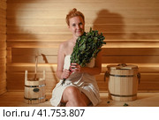 Young pretty girl is steaming in the bath with a broom. Стоковое фото, фотограф Алексей Кузнецов / Фотобанк Лори