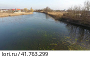 River eric current in the village in the spring. Shallow river, slowly flowing in the village. Стоковое фото, фотограф Леонид Еремейчук / Фотобанк Лори