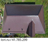 A view from above on the roof of the house. The roof of corrugated sheet. Roofing of metal profile wavy shape. Стоковое фото, фотограф Леонид Еремейчук / Фотобанк Лори
