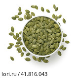 Bowl with green pumpkin seed isolated on white background. Top view. Стоковое фото, фотограф Катерина Ковалева / Фотобанк Лори