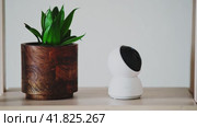 Home surveillance online camera Xiaomi Mi Home, living room white background - Moscow, Russia, October 29, 2022. Редакционное видео, видеограф Андрей Журавлев / Фотобанк Лори