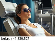 Diode laser hair removal, Beautician removes hair on beautiful female legs, Hair removal for smooth skin, laser procedure at beauty studio or clinic, Body care epilation treatment. Стоковое AI-изображение, AI-художник Ирина Михайличенко / Фотобанк Лори