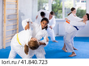 African american teenage girl practicing martial arts fighting techniques in sparring. Стоковое фото, фотограф Яков Филимонов / Фотобанк Лори
