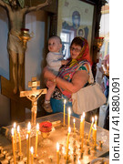 Russia Samara June 25, 2011: Orthodox parishioners came to baptize their babies in the church. Редакционное фото, фотограф Акиньшин Владимир / Фотобанк Лори
