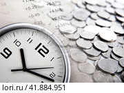 Pile of coins with digits and clock face. Стоковое фото, фотограф Александр Калугин / Фотобанк Лори
