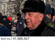 Председатель комитета Госдумы РФ по развитию Дальнего Востока и Арктики Николай Харитонов во время митинга сторонников партии КПРФ в городе Москве, Россия (2023 год). Редакционное фото, фотограф Николай Винокуров / Фотобанк Лори