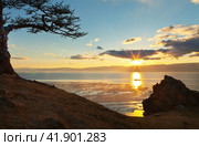 Lake Baikal in May. View from the Olkhon Island to the Small Sea Strait in the rays of the setting sun. Beautiful spring landscape. Стоковое фото, фотограф Виктория Катьянова / Фотобанк Лори