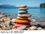 pyramid of smooth stones against the backdrop of a seascape. Rocks Fingers Troll. Iceland. Waves of the Atlantic ocean. Стоковое AI-изображение, AI-художник Ирина Михайличенко / Фотобанк Лори
