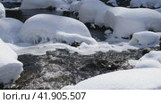 Video of Stones with snow caps and ice in the water of frozen river Pescherka near waterfall in winter season. Russia. Стоковое видео, видеограф Сергей Пристяжнюк (Serg Zastavkin) / Фотобанк Лори