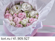 Zephyr bouquet of flowers in a gift box on a light background. Zephyr with a minimum amount of sugar. a natural product. Стоковое фото, фотограф Ирина Ручушкина / Фотобанк Лори