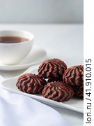 marshmallow in chocolate or marshmallow with a cup of coffee on a gray background of concrete and linen fabric. side view. Стоковое фото, фотограф Ирина Ручушкина / Фотобанк Лори