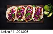 Row of Mexican street Tacos on slate with carne asada and al pastor in corn tortilla. Стоковое AI-изображение, AI-художник Ирина Ручушкина / Фотобанк Лори