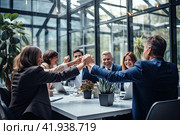 A team of like-minded businessmen celebrates the successful completion of the project. Generated by AI. Стоковое AI-изображение, AI-художник Ярославский Максим / Фотобанк Лори