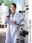 Woman sommelier is tasting wine at wine factory. Стоковое фото, фотограф Татьяна Яцевич / Фотобанк Лори