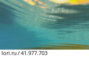 Underwater and then surface slow motion video of catamaran in the bay on Crete, Greece. Редакционное видео, видеограф Сергей Пристяжнюк (Serg Zastavkin) / Фотобанк Лори