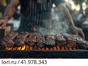 Gaucho cooking the meat on the fire, making the barbecue on the coals, Photos and menus of cafes and restaurants, Magazines. Стоковое AI-изображение, AI-художник Ирина Ручушкина / Фотобанк Лори