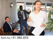 Angry hot-tempered boss shouts yells at hired employee girl in office reception. Стоковое фото, фотограф Яков Филимонов / Фотобанк Лори