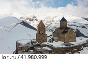 Ancient Gergeti Trinity Church at foot of Kazbek, Georgia. Стоковое фото, фотограф Яков Филимонов / Фотобанк Лори