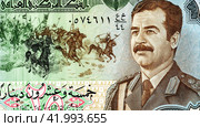 Saddam Hussein (1937-2006) portrait on the Iraq banknote. Стоковое фото, фотограф FotograFF / Фотобанк Лори