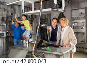 Grandparents and grandchildren resolveing riddles in escape room. Стоковое фото, фотограф Яков Филимонов / Фотобанк Лори