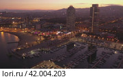 Drone view of the evening Barcelona, the capital of Catalonia, on the Mediterranean coast, Spain. Стоковое видео, видеограф Яков Филимонов / Фотобанк Лори