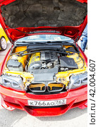 Engine under the hood of a tuning BMW 3 Series vehicle (2023 год). Редакционное фото, фотограф FotograFF / Фотобанк Лори