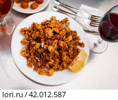 Chipirones, breaded fried calamari with lemon. Стоковое фото, фотограф Яков Филимонов / Фотобанк Лори