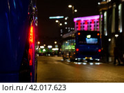 Lights of bus and electrobus in background. Стоковое фото, фотограф Василий Ворона / Фотобанк Лори