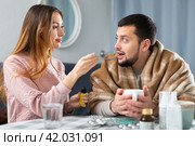 Sick man sitting with wife at home. Стоковое фото, фотограф Яков Филимонов / Фотобанк Лори