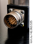 Metal encoder on a black wooden table. Стоковое фото, фотограф Аксенова Вера / Фотобанк Лори