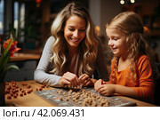 Smiling mother and little daughter playing logic strategy wooden board game at kitchen table together, caring mom teaching adorable kid girl, happy family engaged in educational activity at home. Стоковое AI-изображение, AI-художник Ирина Михайличенко / Фотобанк Лори