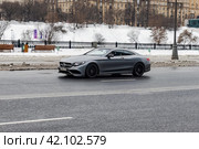 Mercedes AMG S63 coupe car in motion on city street, front side view. Редакционное фото, фотограф Константин Григорьев / Фотобанк Лори