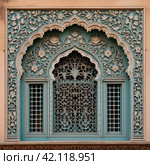 Ornament lattice window in india. Стоковое AI-изображение, AI-художник Михаил Коханчиков / Фотобанк Лори