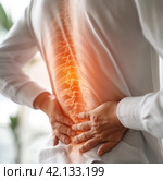 A man holds his sore back. Стоковое AI-изображение, AI-художник Кирилл Черезов / Фотобанк Лори