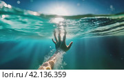 Reaching for the Surface Underwater. A single hand reaches towards the sunlight piercing through the water's surface, depicting a struggle for air. Стоковое AI-видео, аниматор Igor Tichonow / Фотобанк Лори