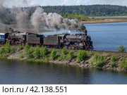 Два старых советских паровоза на дамбе. Карелия (2022 год). Редакционное фото, фотограф Анна Карасева / Фотобанк Лори