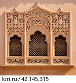 Ornament lattice window in india. Стоковое AI-изображение, AI-художник Михаил Коханчиков / Фотобанк Лори