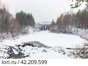 Winter landscape with Palyeozerskaya hydroelectric power station on the background. Стоковое фото, фотограф EugeneSergeev / Фотобанк Лори