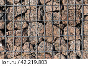 Close up photo texture of gabion wall, steel cages filled with stones. Стоковое фото, фотограф EugeneSergeev / Фотобанк Лори
