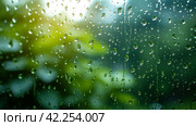 Glistening raindrops on windowpanes create a soothing, minimalist spring setting. Стоковое AI-изображение, AI-художник Юлия Гапеенко / Фотобанк Лори