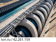 Close-up pipes of modern giant dam on Parana river, South America. Itaipu Binacional hydroelectric power station in Foz do Iguazu Brazil on border Paraguay. Hydro electrification concept. Copy space. Стоковое AI-изображение, AI-художник Aleksandr Golubev / Фотобанк Лори