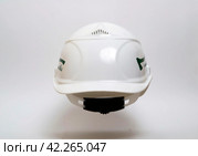 White protective helmet for construction and for loggers. Стоковое фото, фотограф Дмитрий Львович Алферов / Фотобанк Лори